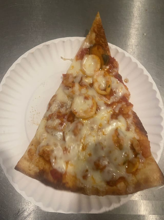 Seafood Pizza Slice.