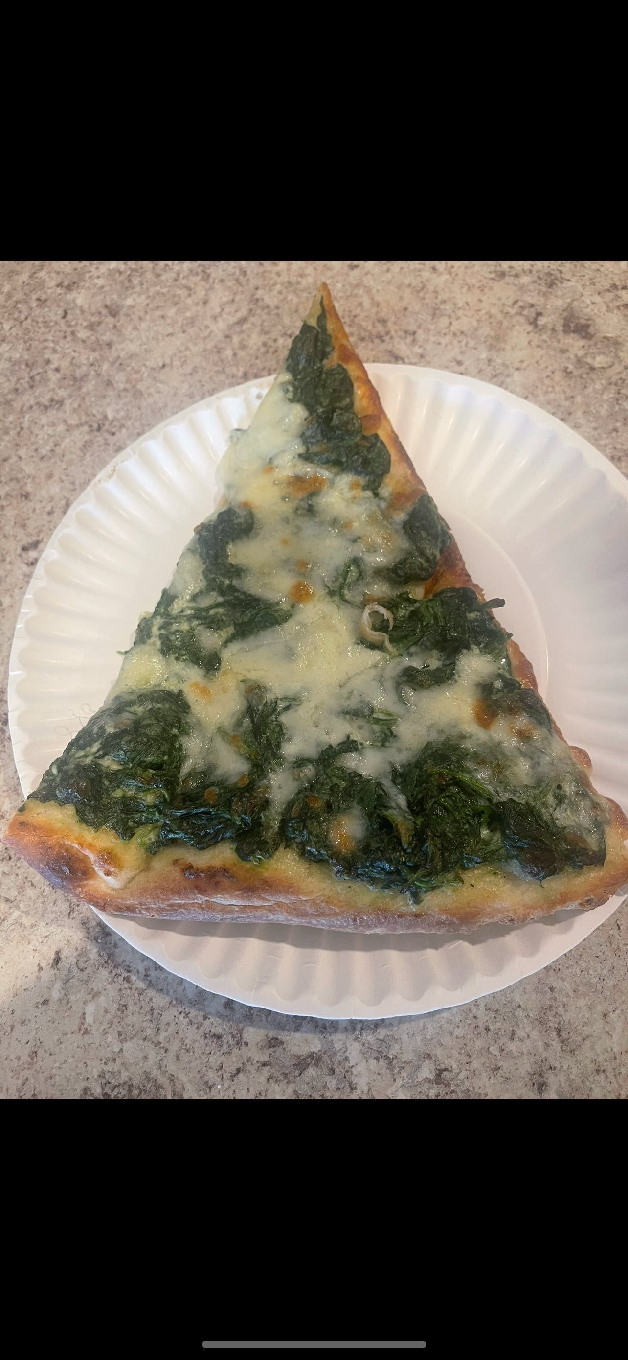 Spinach Alfredo Pizza Slice.